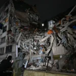 Rescuers search through rubble after a powerful earthquake in Colombia