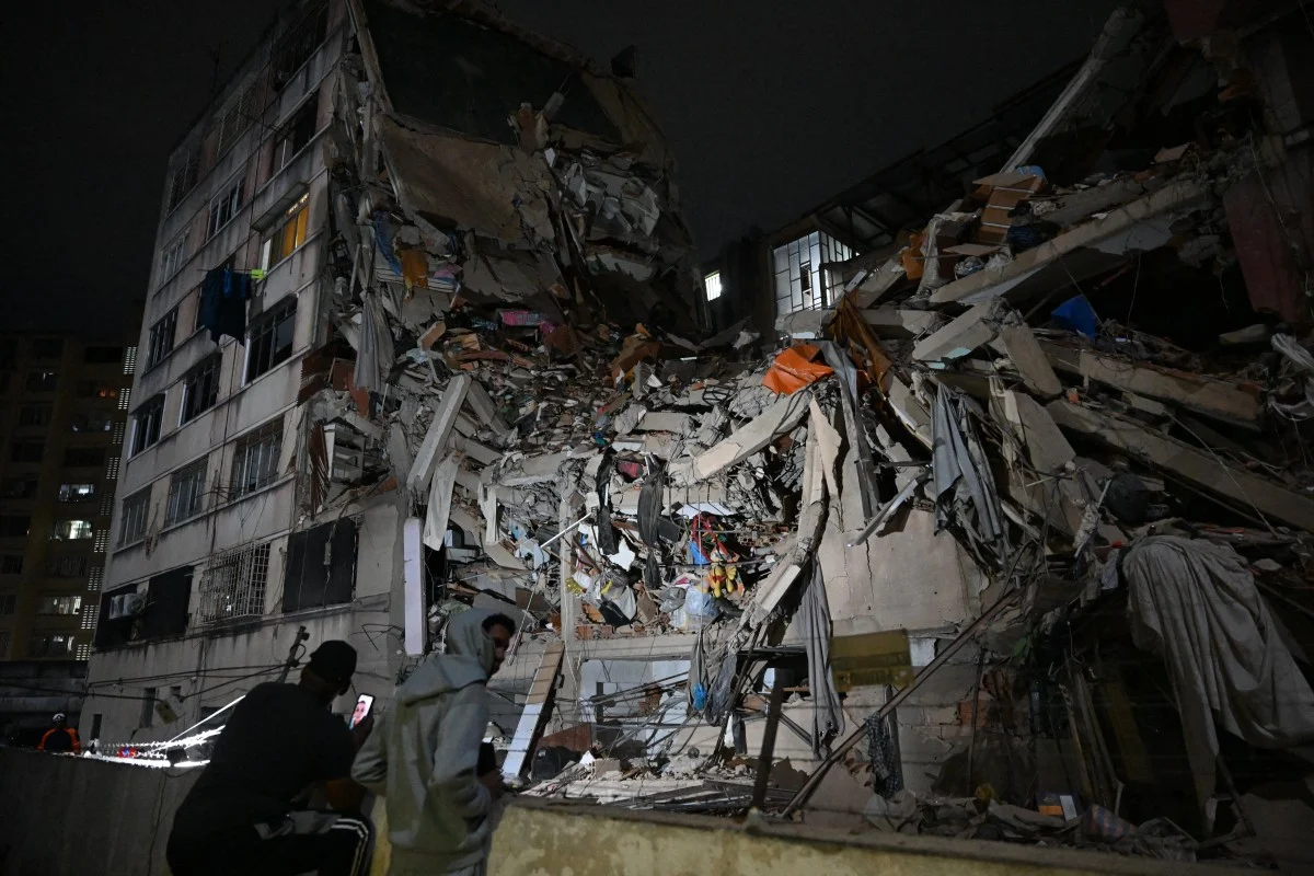 Rescuers search through rubble after a powerful earthquake in Colombia