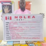 NDLEA officials display seized cocaine during an operation against an alleged international drug trafficking cartel in Nigeria.