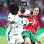 Cameroon players celebrate after defeating Morocco on penalties to reach the WAFCON 2026 final
